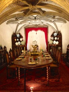Dining table set as it was in the late 1800's. Look at all the wine glasses. 