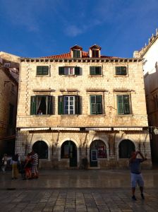 See the lady that lives in this apartment? She gets to watch the entertainment every day!