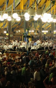 The band is in the middle of the tent.