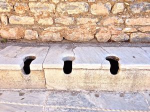 These are the toilets for everyone to use. They are directly across from the Terrace Houses. We were told that some people would send their servants down to sit on these to warm them up for them to use.