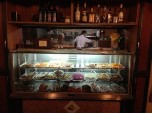 This is the cook and our dishes are in the glass case, we picked whatever we wanted! They grilled up our main course right there!