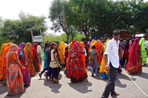 They are all singing and going to temple.