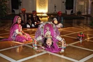 Not sure if you can see this (double click to enlarge the photo) but she is doing a backbend to pick up two rings with her EYES!