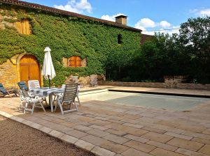 And here is our backyard, the pool cover is ON, the doors open to a large barn with ping pong, darts, fusseball table.