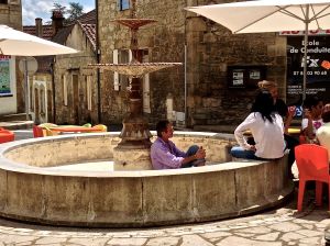 We think this is what the French do when there is no water in the fountain and sunny skies above!