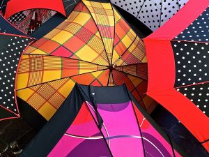 In addition to food, the Sarlat market has other vendors. In this photo, the vendor is selling umbrellas. 