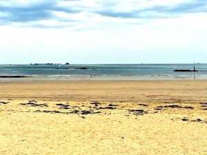 The beach at Dinard. Notice the low tide and wide sandy beach.