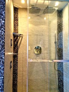 This is one of the modern showers we blogged about. It has two rain shower heads and jet sprays on the sides. It also has a sign about saving the world by not laundering towels each day!!