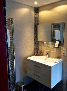 Modern, or Contemporary Vanity, with towel warmer for those cool mornings. 
