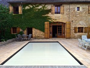 Photo of main house with pool, covered of course.