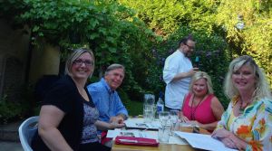 The owner is in the background, he pours drinks, cooks the food, and tells great stories of his past life cooking on a yacht and for Whitney Houston!