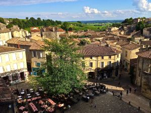 The central "place" in St. Emilion, another wine area of Bordeaux is dotted with outdoor restaurants serving good food and wine.