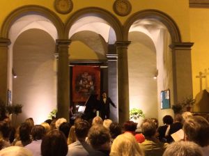 Opera singers from around the world serenading an audience of Italians and tourists from the steps of St. Croce at one end of Greve's main square.