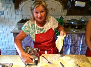 Rita getting the hang of making homemade pasta while I get the hang of photographing Rita making homemade pasta.  