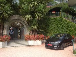 Here's Norm!! We're wondering why our car gets to be parked right here at the entrance, it's not a Ferrari or a Lamborghini !!!!