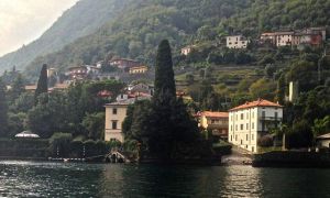 First sighting of George's home, on the left, behind the BIG trees. You can't see, but there are two other buildings (large homes) behind this that is also on his compound. One is a studio. 